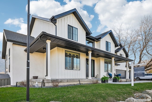 52 N 400 W, Farmington, UT 84025 - view of front of home featuring board and batten siding, covered porch, and a front yard