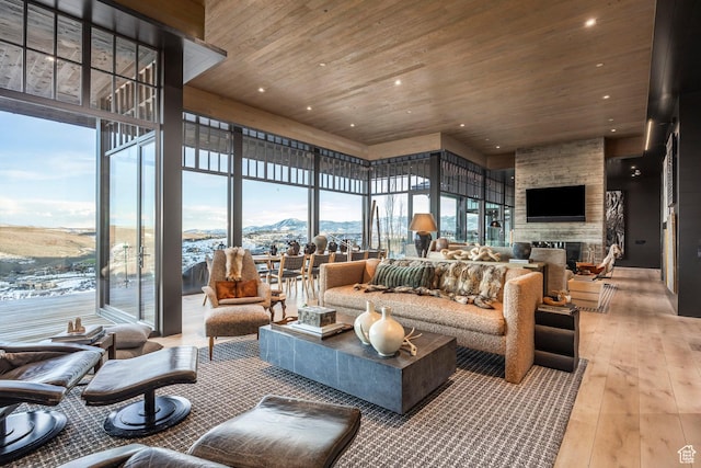 8006 N Sunrise Loop, Park City, UT 84098 - living room with a fireplace, recessed lighting, light wood-style floors, and wood ceiling