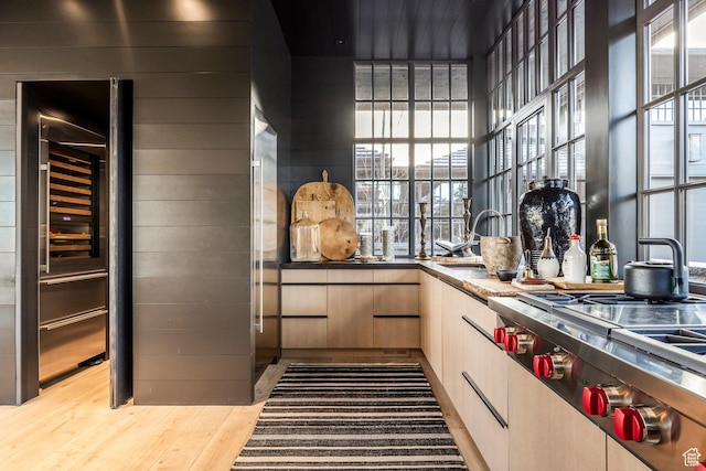 8006 N Sunrise Loop, Park City, UT 84098 - kitchen with a sink, stainless steel gas stovetop, a healthy amount of sunlight, and wood finished floors