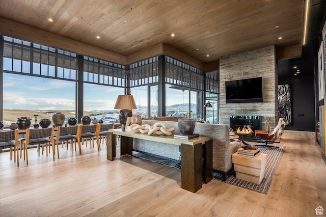 8006 N Sunrise Loop, Park City, UT 84098 - living area with wooden ceiling, hardwood / wood-style flooring, a stone fireplace, and recessed lighting