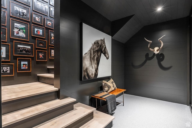 8006 N Sunrise Loop, Park City, UT 84098 - stairway featuring carpet floors, lofted ceiling, and wooden walls