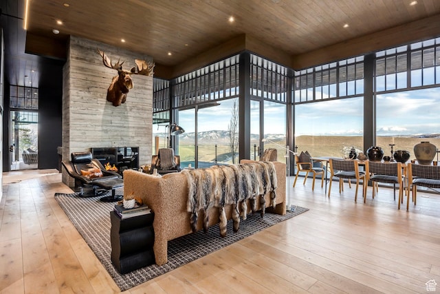 8006 N Sunrise Loop, Park City, UT 84098 - living area featuring a high ceiling, a healthy amount of sunlight, wooden ceiling, and wood-type flooring