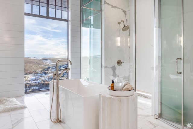 8006 N Sunrise Loop, Park City, UT 84098 - bathroom featuring a freestanding bath, marble finish floor, a shower stall, and plenty of natural light