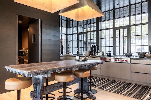 8006 N Sunrise Loop, Park City, UT 84098 - kitchen with wood finished floors, a kitchen breakfast bar, and wood walls
