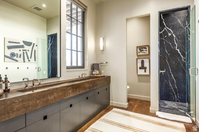 8006 N Sunrise Loop, Park City, UT 84098 - full bath featuring visible vents, baseboards, double vanity, a marble finish shower, and toilet