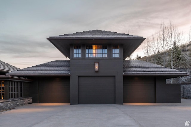 8006 N Sunrise Loop, Park City, UT 84098 - view of front of home with driveway, an attached garage, and a tiled roof