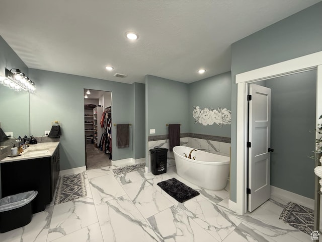1240 W 2360 N, Helper, UT 84526 - full bathroom with vanity, a freestanding tub, recessed lighting, a spacious closet, and visible vents