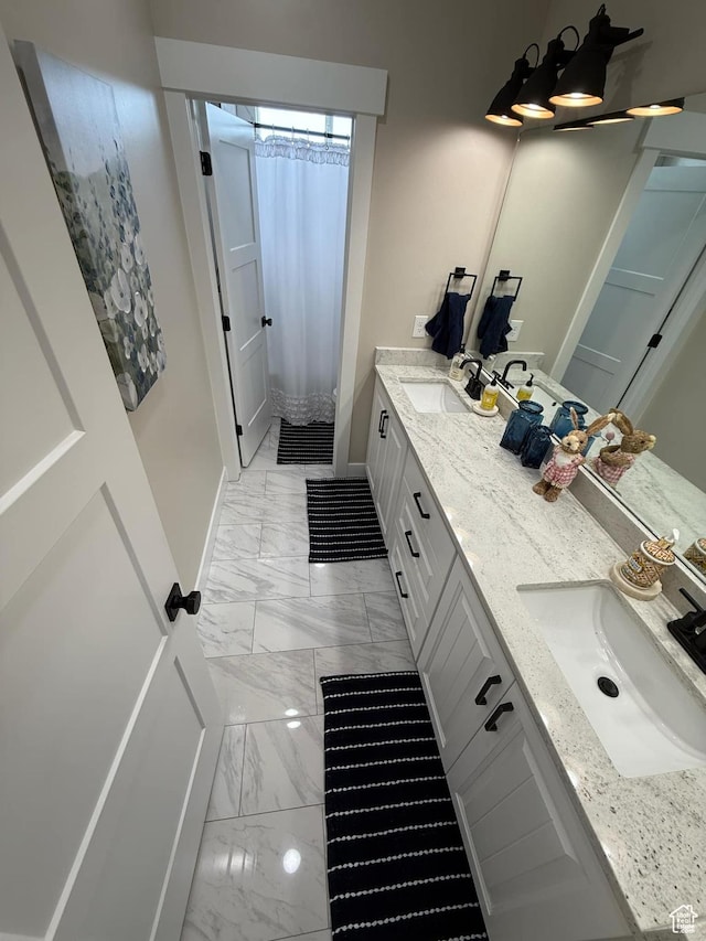1240 W 2360 N, Helper, UT 84526 - full bath with marble finish floor, a sink, double vanity, and baseboards