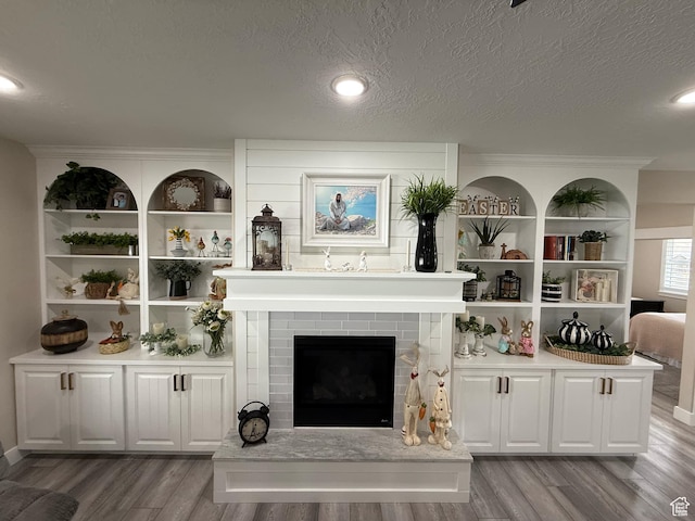 1240 W 2360 N, Helper, UT 84526 - living area with a textured ceiling, a fireplace, and wood finished floors