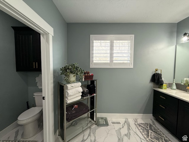 1240 W 2360 N, Helper, UT 84526 - bathroom with vanity, toilet, baseboards, marble finish floor, and visible vents