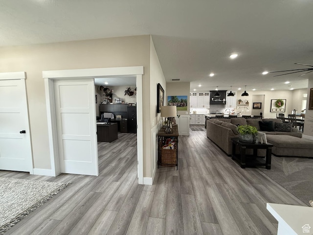 1240 W 2360 N, Helper, UT 84526 - living area with baseboards, ceiling fan, recessed lighting, and light wood-style floors