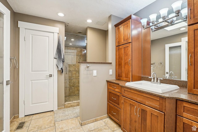 1349 E Madera Hills Dr S, Bountiful, UT 84010 - bathroom with tiled shower, vanity, baseboards, and an inviting chandelier