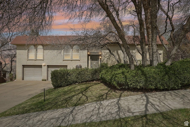 1349 E Madera Hills Dr S, Bountiful, UT 84010 - raised ranch with brick siding, a front yard, a garage, and driveway