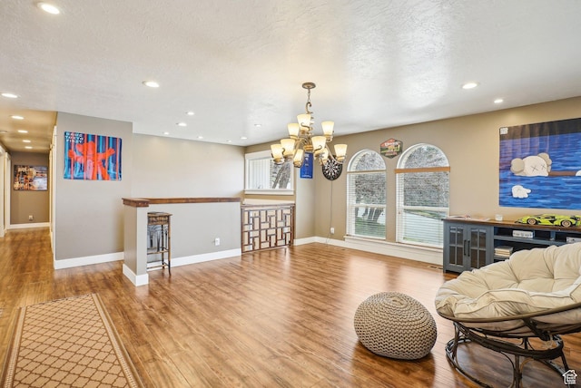 1349 E Madera Hills Dr S, Bountiful, UT 84010 - interior space featuring an inviting chandelier, a textured ceiling, recessed lighting, wood finished floors, and baseboards