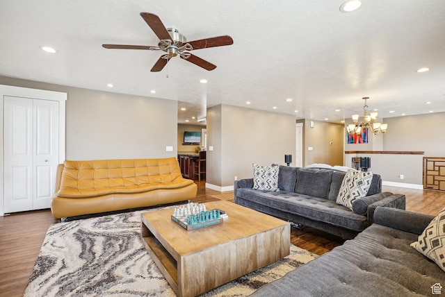 1349 E Madera Hills Dr S, Bountiful, UT 84010 - living area with wood finished floors, ceiling fan with notable chandelier, baseboards, and recessed lighting