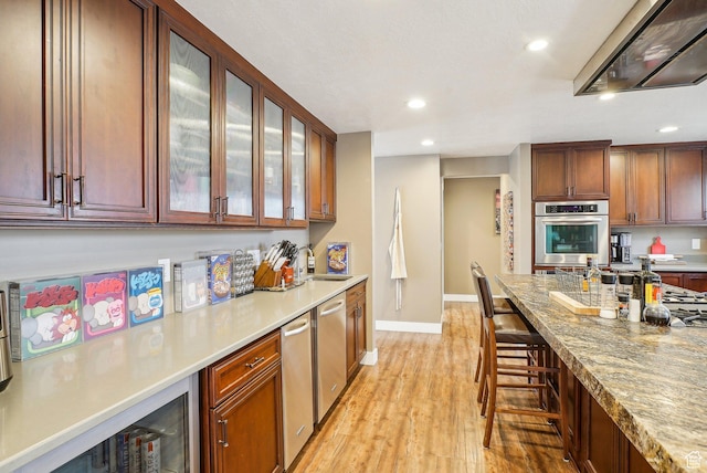 1349 E Madera Hills Dr S, Bountiful, UT 84010 - kitchen featuring light wood-type flooring, exhaust hood, a sink, and recessed lighting