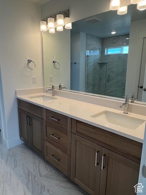 3199 N 3500 W Unit 379, Plain City, UT 84404 - bathroom featuring double vanity, a marble finish shower, and marble finish flooring