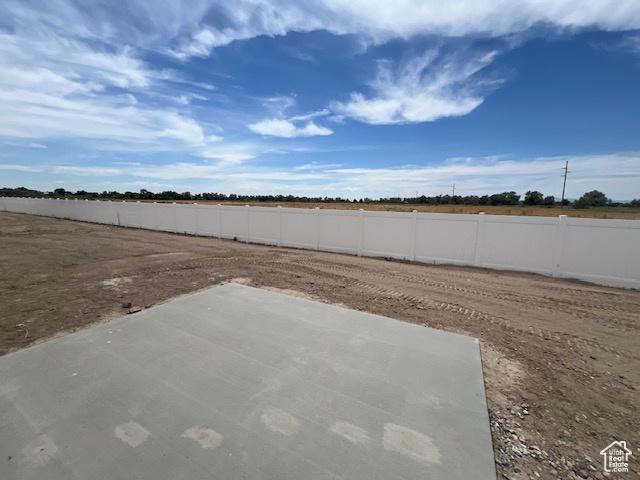 3199 N 3500 W Unit 379, Plain City, UT 84404 - fenced yard with a patio area