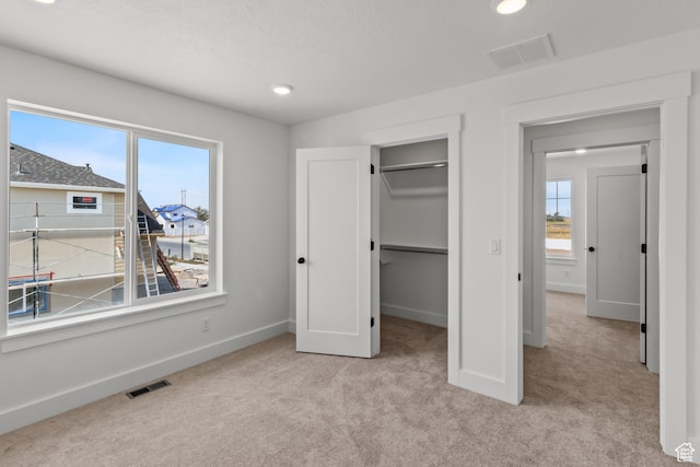3199 N 3500 W Unit 379, Plain City, UT 84404 - unfurnished bedroom with baseboards, visible vents, and carpet