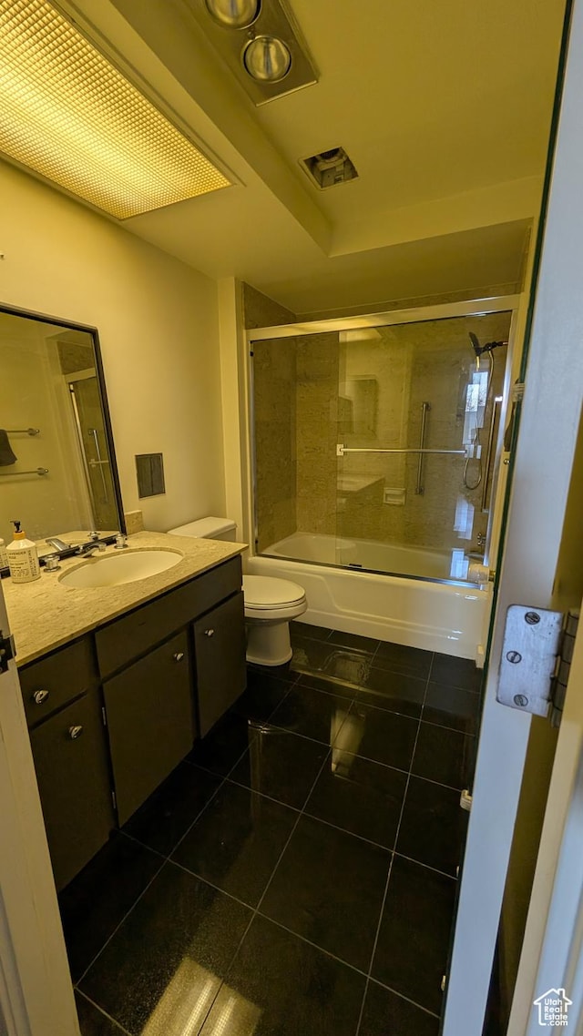 777 E S Temple Unit 3J, Salt Lake City, UT 84102 - full bath featuring vanity, visible vents, toilet, tile patterned floors, and enclosed tub / shower combo