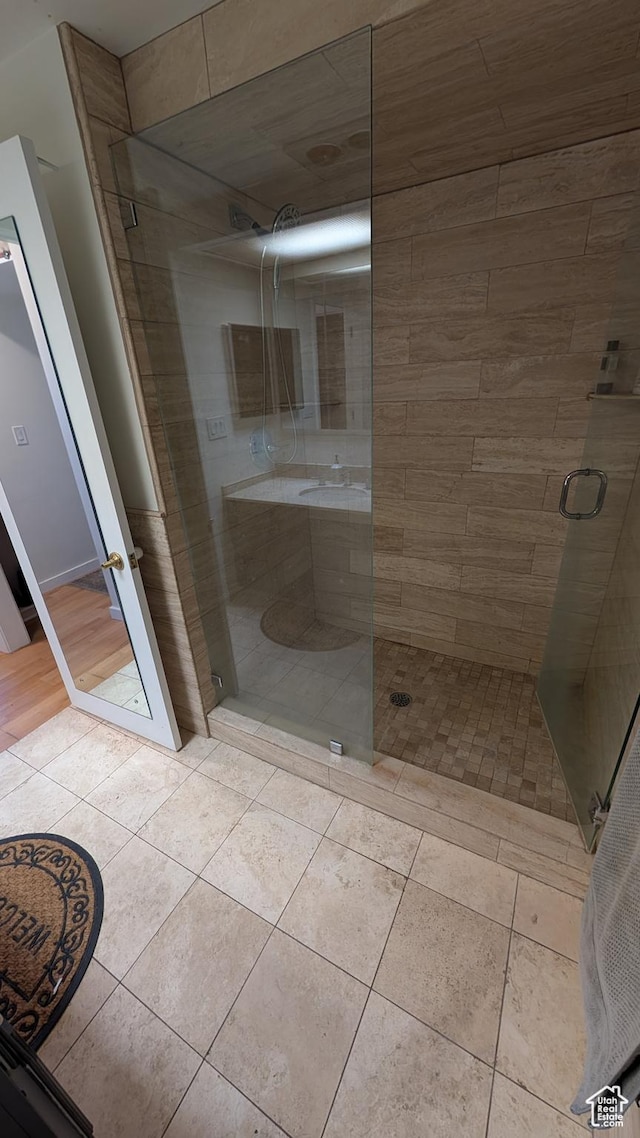777 E S Temple Unit 3J, Salt Lake City, UT 84102 - bathroom featuring tile patterned flooring and a shower stall