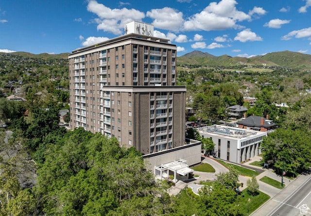 view of building exterior featuring a mountain view