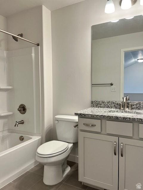 6850 S Static Peak Dr Unit 261, West Jordan, UT 84081 - bathroom featuring tile patterned floors, toilet, vanity, and washtub / shower combination