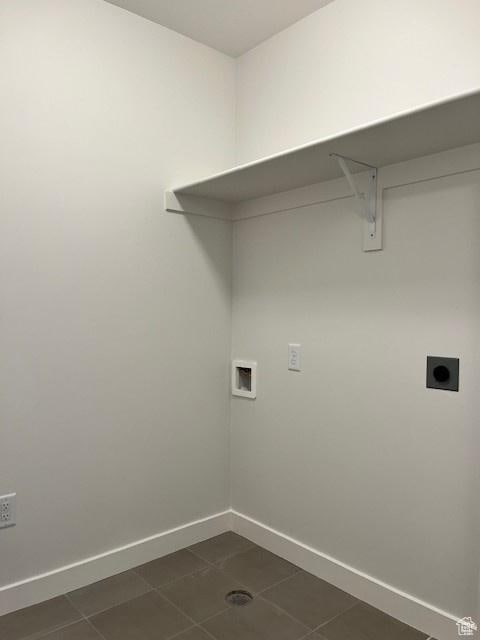 6850 S Static Peak Dr Unit 261, West Jordan, UT 84081 - clothes washing area with laundry area, dark tile patterned flooring, hookup for an electric dryer, hookup for a washing machine, and baseboards