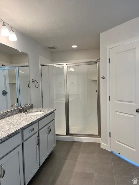 6850 S Static Peak Dr Unit 261, West Jordan, UT 84081 - bathroom featuring recessed lighting, visible vents, a shower stall, tile patterned flooring, and vanity