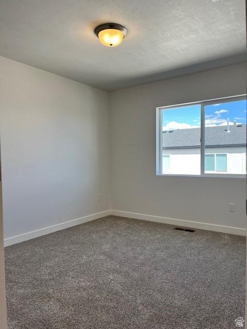 6850 S Static Peak Dr Unit 261, West Jordan, UT 84081 - carpeted empty room featuring baseboards and visible vents