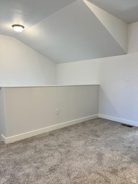 6850 S Static Peak Dr Unit 261, West Jordan, UT 84081 - additional living space featuring carpet flooring, visible vents, baseboards, and lofted ceiling