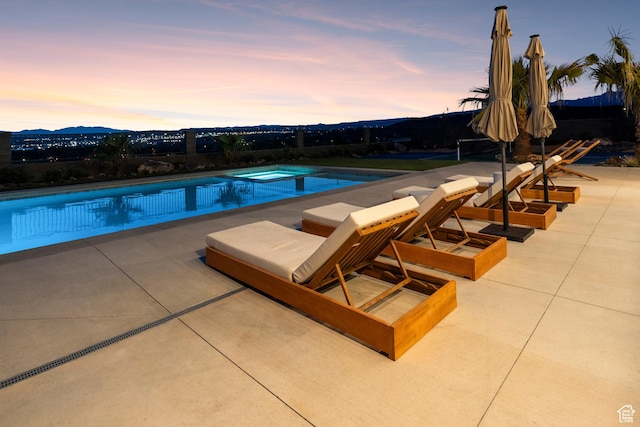 1248 S Seminole Way, Washington, UT 84780 - pool at dusk with a patio and an outdoor pool