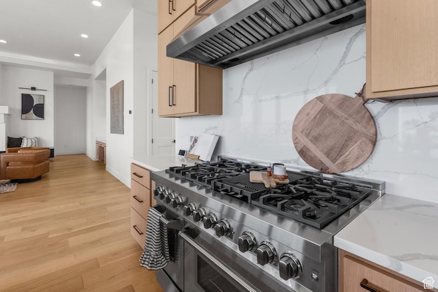 1248 S Seminole Way, Washington, UT 84780 - kitchen with stove, custom range hood, recessed lighting, light wood finished floors, and light brown cabinetry