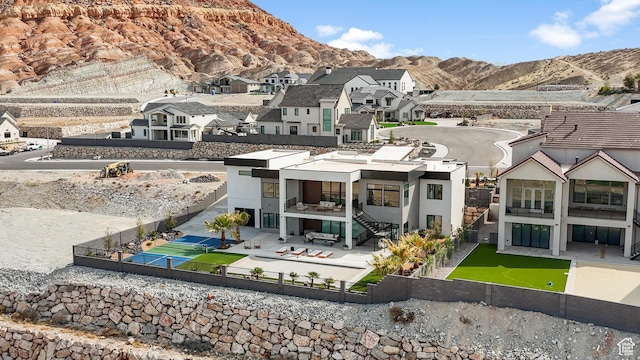 1248 S Seminole Way, Washington, UT 84780 - rear view of property with a patio, a fenced backyard, a mountain view, a residential view, and a balcony