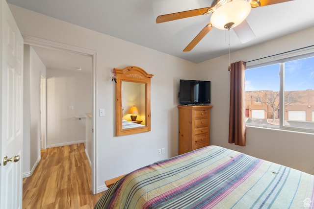 3245 E Fairway Loop, Moab, UT 84532 - bedroom featuring ceiling fan, light wood finished floors, and baseboards
