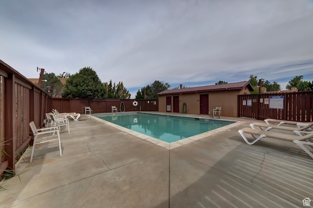 3245 E Fairway Loop, Moab, UT 84532 - community pool featuring a patio and fence