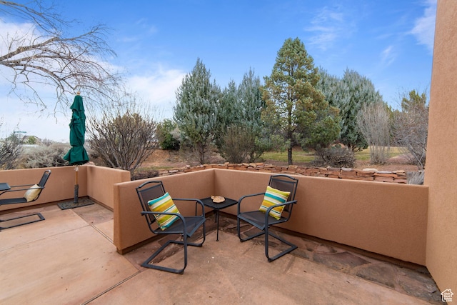 view of patio / terrace with a fire pit