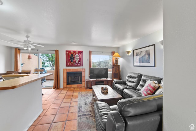3245 E Fairway Loop, Moab, UT 84532 - living room featuring ceiling fan, a healthy amount of sunlight, light tile patterned floors, and a tiled fireplace