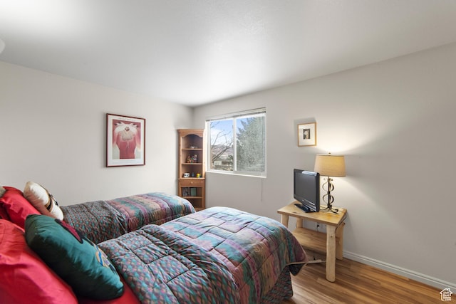 3245 E Fairway Loop, Moab, UT 84532 - bedroom with baseboards and wood finished floors