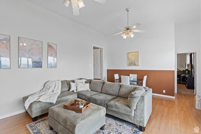 6958 S Sunrise Hills Cir E, Cottonwood Heights, UT 84121 - living room featuring a ceiling fan, light wood finished floors, and baseboards