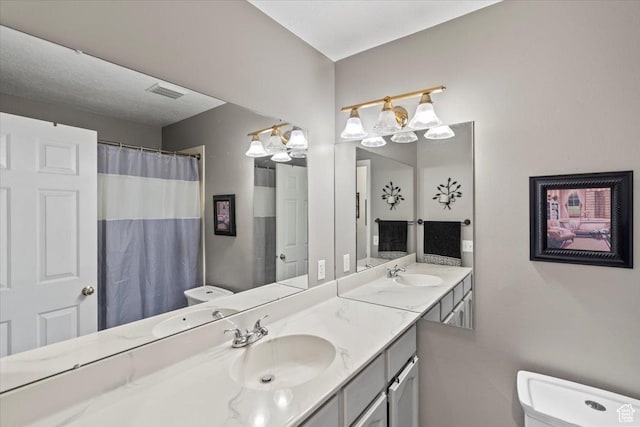 6958 S Sunrise Hills Cir E, Cottonwood Heights, UT 84121 - bathroom featuring toilet, a sink, and visible vents