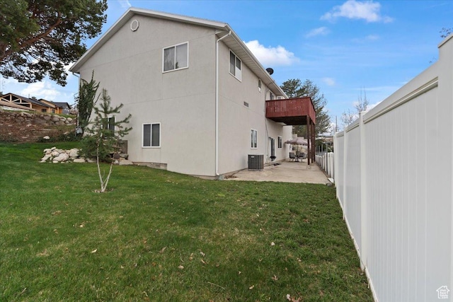 6958 S Sunrise Hills Cir E, Cottonwood Heights, UT 84121 - rear view of property featuring a patio, central air condition unit, a lawn, and stucco siding