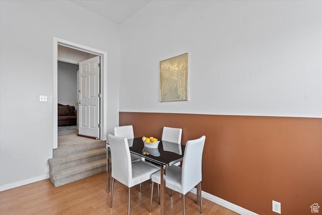 6958 S Sunrise Hills Cir E, Cottonwood Heights, UT 84121 - dining space featuring baseboards and wood finished floors