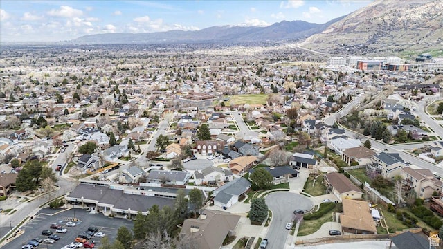 6958 S Sunrise Hills Cir E, Cottonwood Heights, UT 84121 - drone / aerial view featuring a mountain view and a residential view