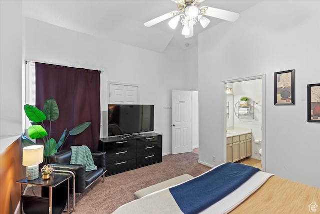 6958 S Sunrise Hills Cir E, Cottonwood Heights, UT 84121 - carpeted bedroom with ceiling fan, ensuite bathroom, high vaulted ceiling, and baseboards