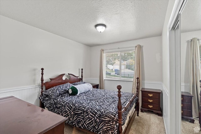 6958 S Sunrise Hills Cir E, Cottonwood Heights, UT 84121 - bedroom with a wainscoted wall, a textured ceiling, and carpet flooring