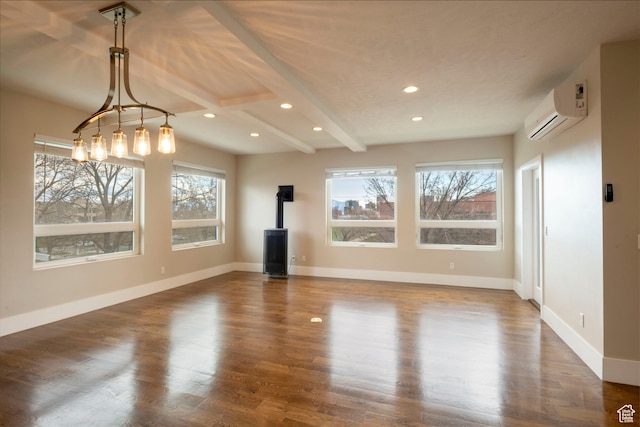 51 S 800 E, Salt Lake City, UT 84102 - unfurnished living room featuring wood finished floors, a wall unit AC, baseboards, and a wood stove