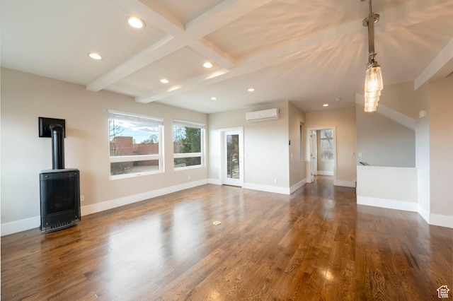 51 S 800 E, Salt Lake City, UT 84102 - unfurnished living room featuring a wall unit AC, baseboards, beamed ceiling, recessed lighting, and dark wood-style flooring