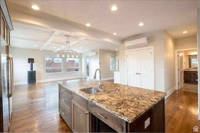 51 S 800 E, Salt Lake City, UT 84102 - kitchen with a wall mounted AC, stainless steel fridge, a sink, dark wood-style floors, and a wood stove