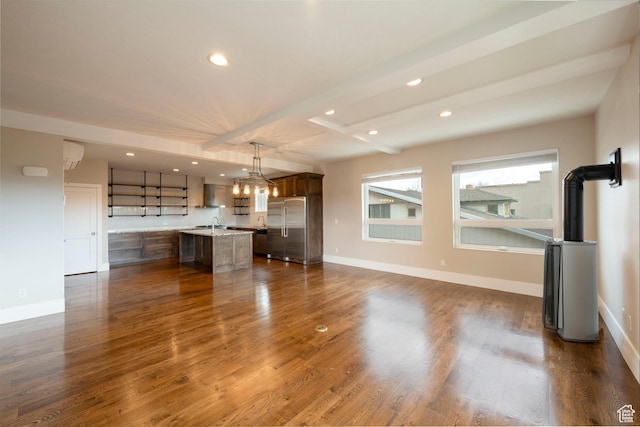 51 S 800 E, Salt Lake City, UT 84102 - unfurnished living room featuring baseboards, recessed lighting, dark wood-type flooring, and beam ceiling